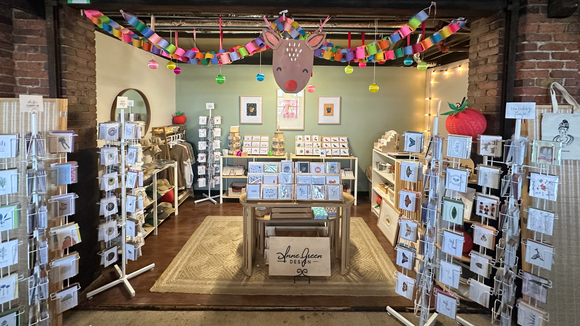 Stationery and gift store with paper goods, apparel, and unique gift items.